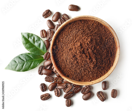 Bowl of ground coffee and beans isolated on white background