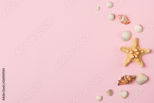 Seashells and starfish on a pale pink background. Summer time concept. Top view © KsPhoto