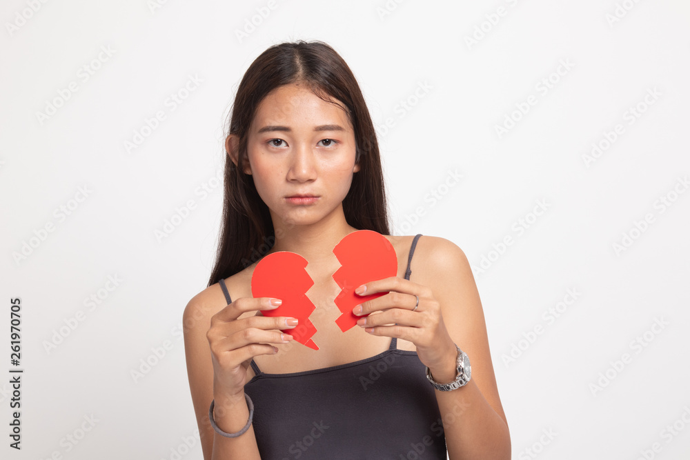 Beautiful young Asian woman with broken heart. Beautiful young Asian woman with broken heart.
