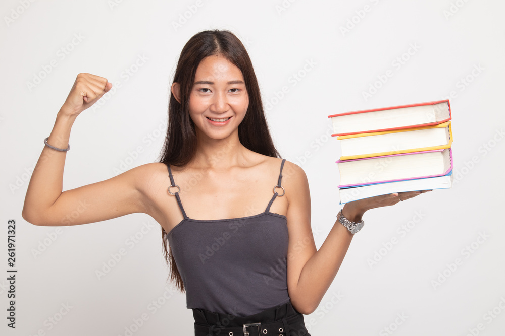 Young Asian woman studying with may books. Young Asian woman studying with may books.