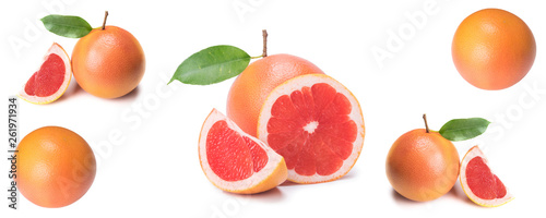 Isolated citrus, fresh pink grapefruit whole and slices, on white background, close-up