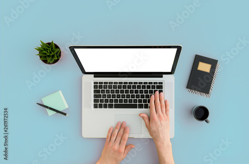 Man using laptop mockup. Top view on hands typing on keyboard.