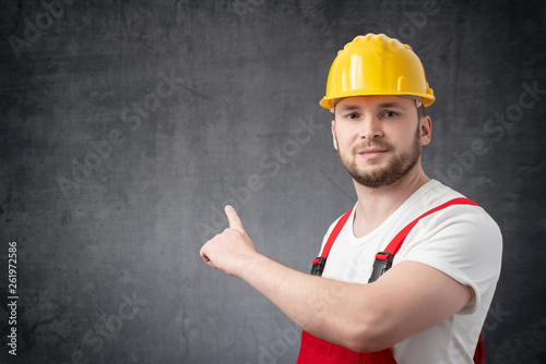 Worker pointing at the wall