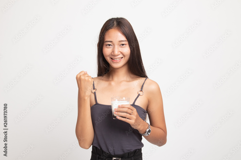 Healthy Asian woman drinking a glass of milk. Healthy Asian woman drinking a glass of milk.