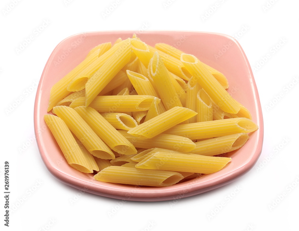 Penne rigate pasta pile in porcelain bowl isolated on white background Penne rigate pasta pile in porcelain bowl isolated on white background