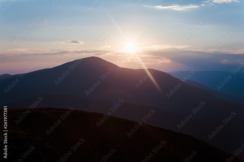 the rays of the evening sun over the mountains the rays of the evening sun over the mountains