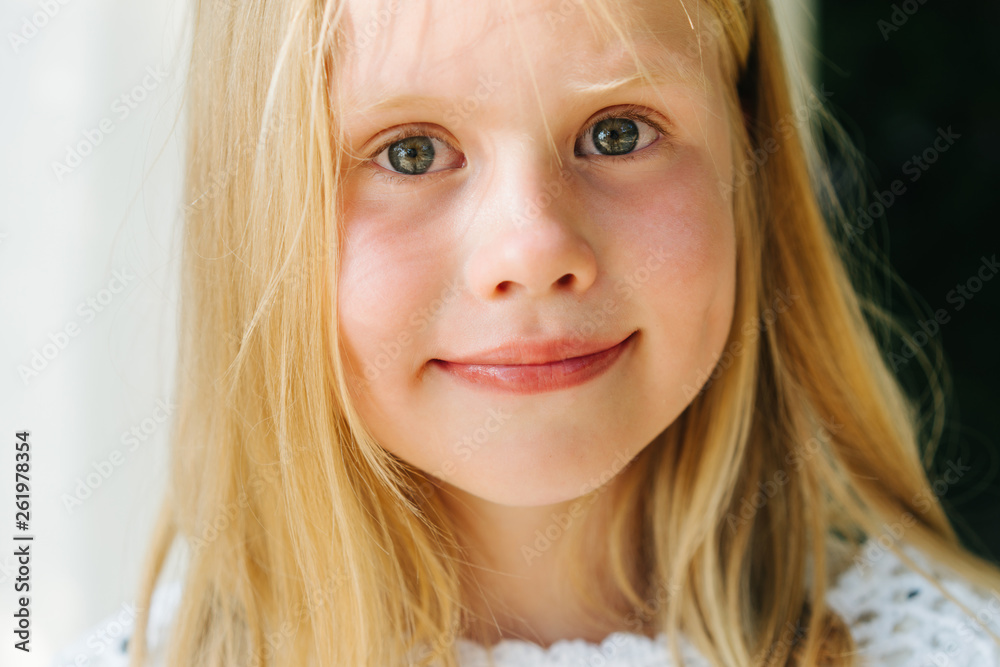 Portrait of a little blonde girl with blurred background Portrait of a little blonde girl with blurred background
