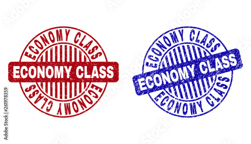 Grunge ECONOMY CLASS round stamp seals isolated on a white background. Round seals with distress texture in red and blue colors.