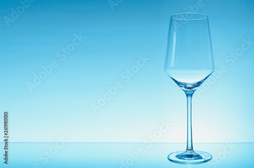 glass of white wine with wave on white background