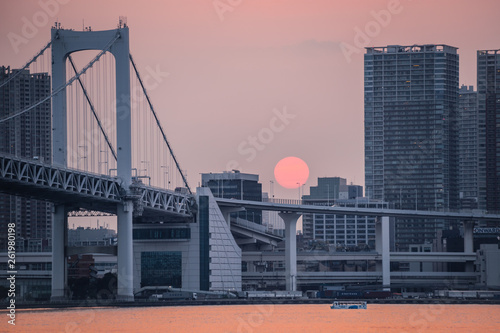 Minato, Tokyo, Japan, 04/06/2019 , Highway to the Rainbow Bridge, connecting Odaiba with Tokyo during sunset.