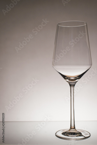 glass of white wine with wave on white background