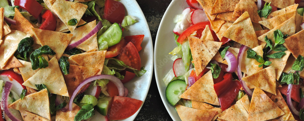 Bright healthy salad with vegetables and pita bread. Middle Eastern cuisine. Arab salad Fattush. Bright healthy salad with vegetables and pita bread. Middle Eastern cuisine. Arab salad Fattush.