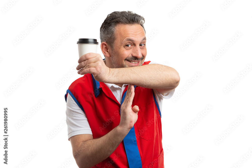 Supermarket employee holding coffee cup and making time out gesture. Supermarket employee holding coffee cup and making time out gesture.