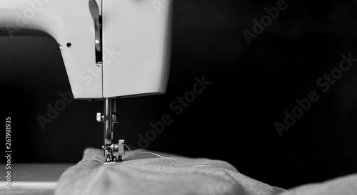 Background type of sewing machine, tailoring process. sewing workshop. photo