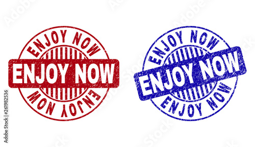 Grunge ENJOY NOW round stamp seals isolated on a white background. Round seals with grunge texture in red and blue colors. Vector rubber overlay of ENJOY NOW label inside circle form with stripes.