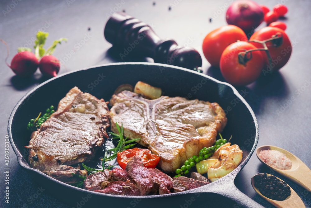 Grilled ribeye beef steak, herbs and spices. Top view Grilled ribeye beef steak, herbs and spices. Top view