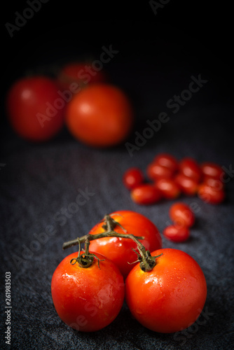 red tomato on wood background