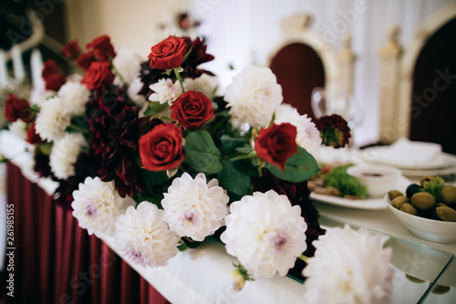 bouquet of red flowers on wedding table