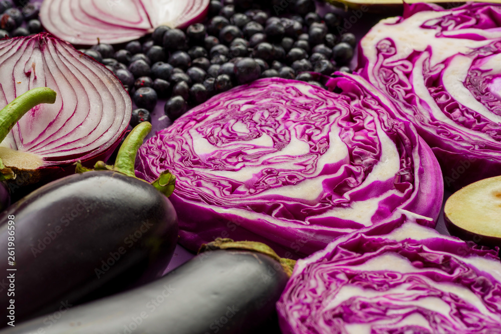 Obraz premium purple onions, eggplant, garlic, currants, red cabbage, agricultural still life in purple colors