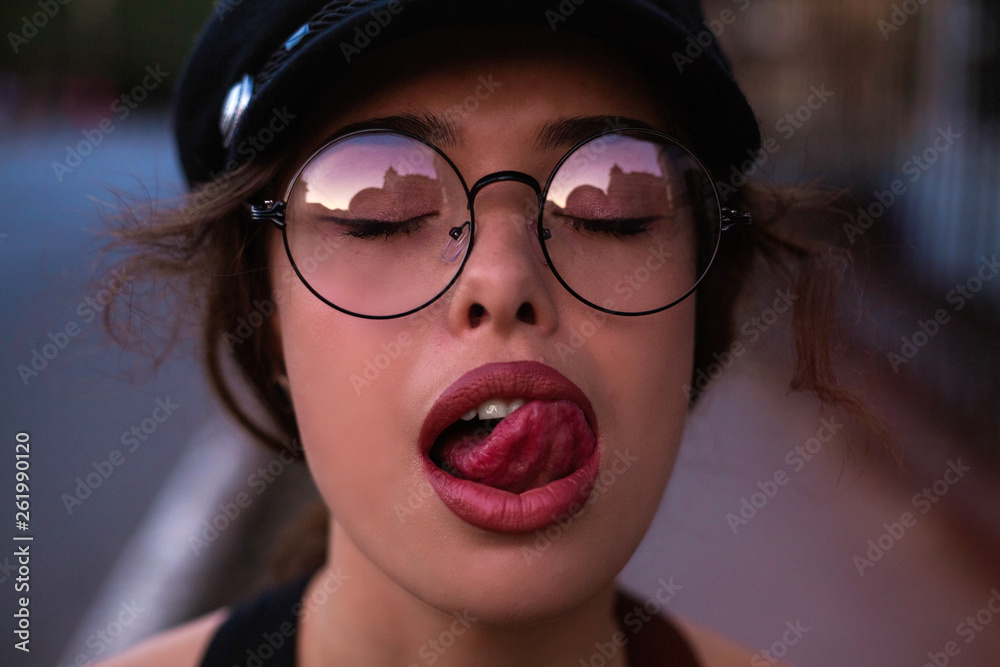 Emotional Girl Beautiful Modern Model Shows Tongue Positive Woman Hipster Emotions On Face 
