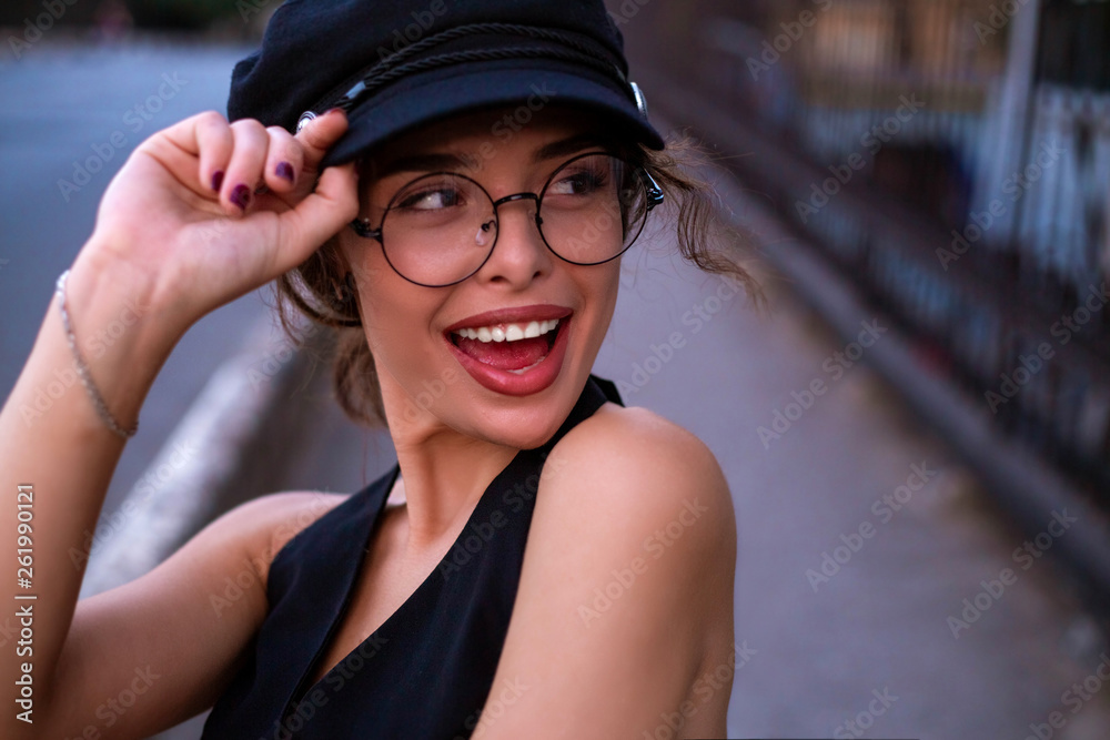 Outdoors close up fashion portrait of beautiful young girl laughing.Stunning smiling brunette woman, portrait Outdoors close up fashion portrait of beautiful young girl laughing.Stunning smiling brunette woman, portrait