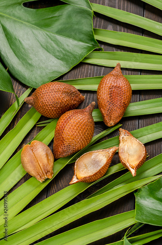 Snake fruit, rakum, sala on wood background photo