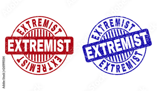 Grunge EXTREMIST round stamp seals isolated on a white background. Round seals with distress texture in red and blue colors. Vector rubber imprint of EXTREMIST title inside circle form with stripes.