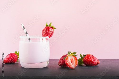 Strawberry milkshake with berry. Close up. Summer pink drink.