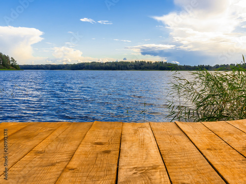 Empty wooden pier for swimming, boats or fishing on the lake