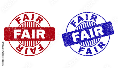 Grunge FAIR round stamp seals isolated on a white background. Round seals with distress texture in red and blue colors. Vector rubber watermark of FAIR tag inside circle form with stripes.
