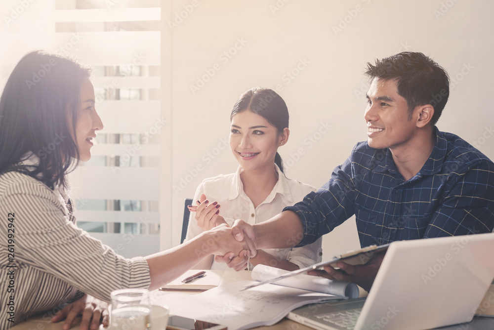 Fototapeta premium Business negotiation concept; Business people handshaking to sign contract of business