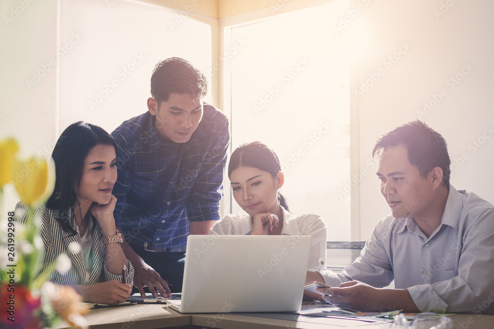 Businesspeople discuss a project ;A woman sitting at the computer shows infographics to partners; An example of good relations at work