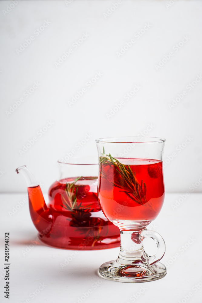 Hot raspberry beverage with rosemary. Selective focus. Shallow depth of field.