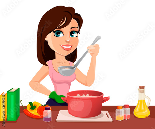 Beautiful woman cooking in her kitchen