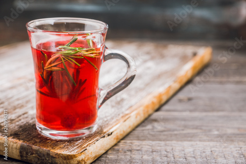 Hot raspberry beverage with rosemary. Selective focus. Shallow depth of field.