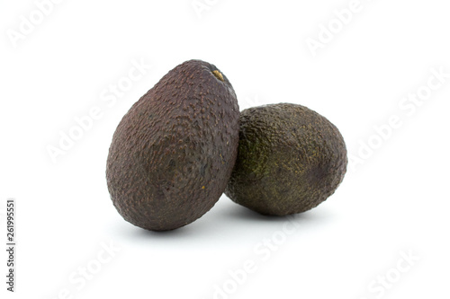 Two avocados or alligator pears on white background. Avocado has many nutrients.
