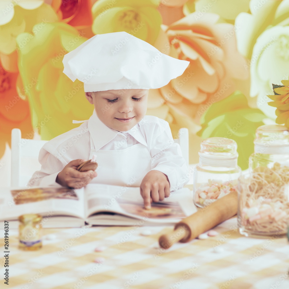 happy little boy with a book chef preparing Breakfast the kit happy little boy with a book chef preparing Breakfast the kit