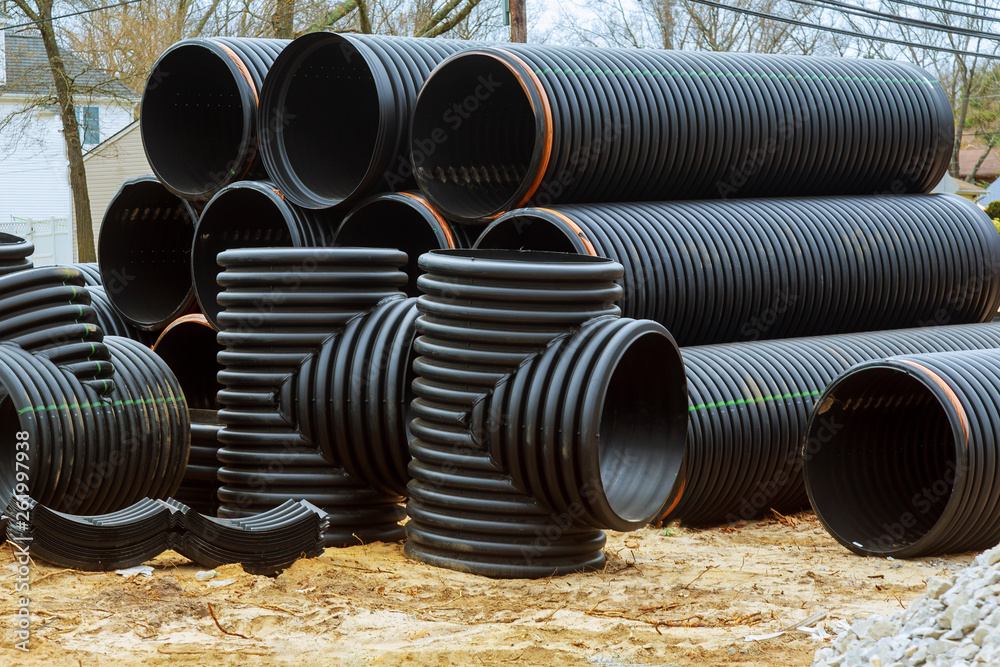Stacked new PVC pipe on construction of housing project Stock Photo ...