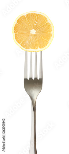Lemon cut on impaled on a fork isolated on white background with clipping path.