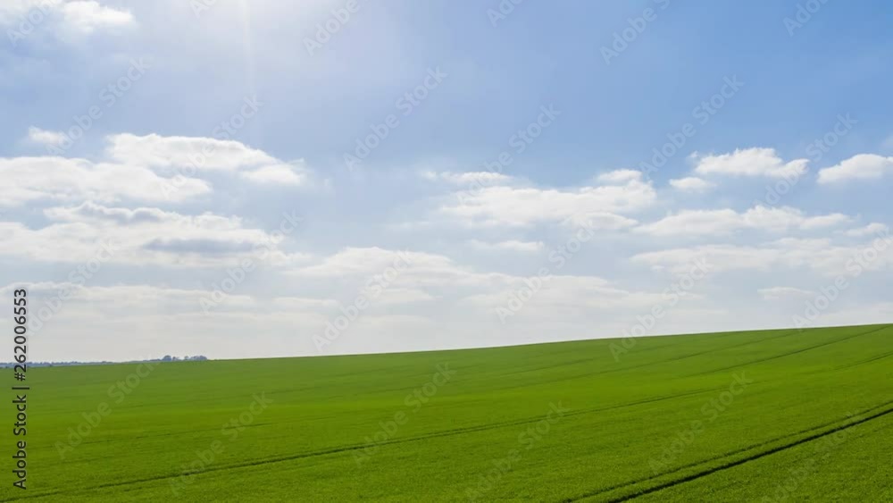 Panning aerial motion time  lapse over the English countryside at dawn in the English countryside