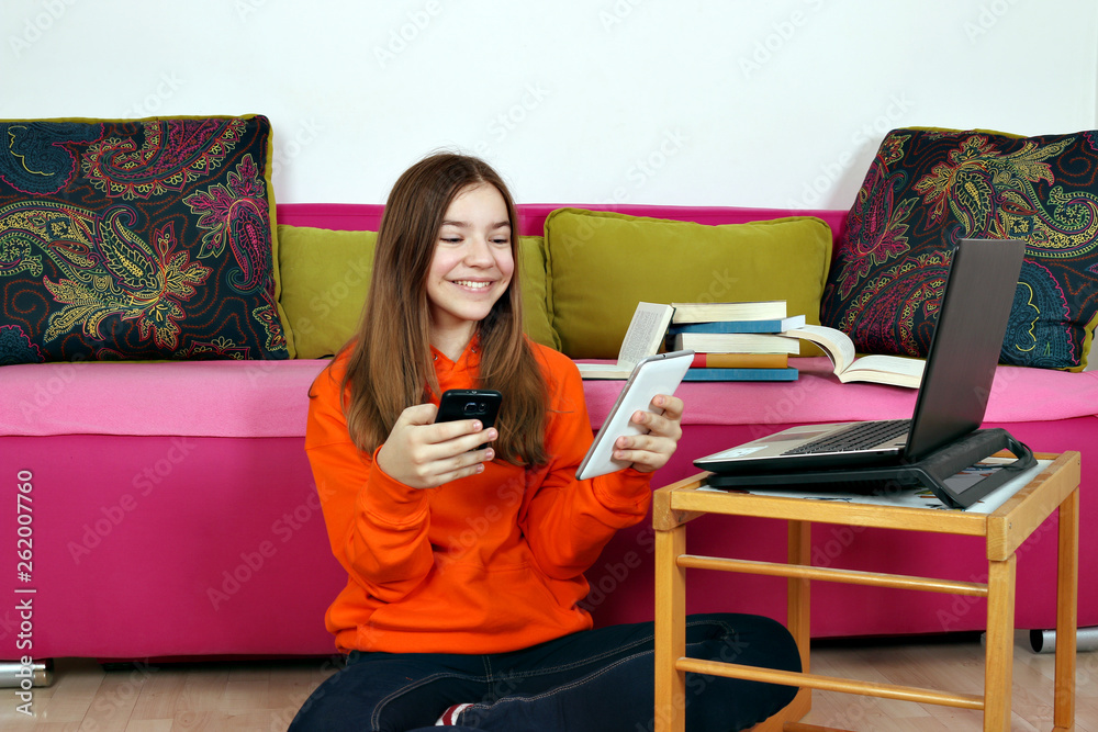 happy teenage girl with smartphone tablet and laptop happy teenage girl with smartphone tablet and laptop