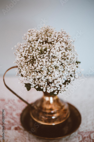 bridal bouquet in an antique jug