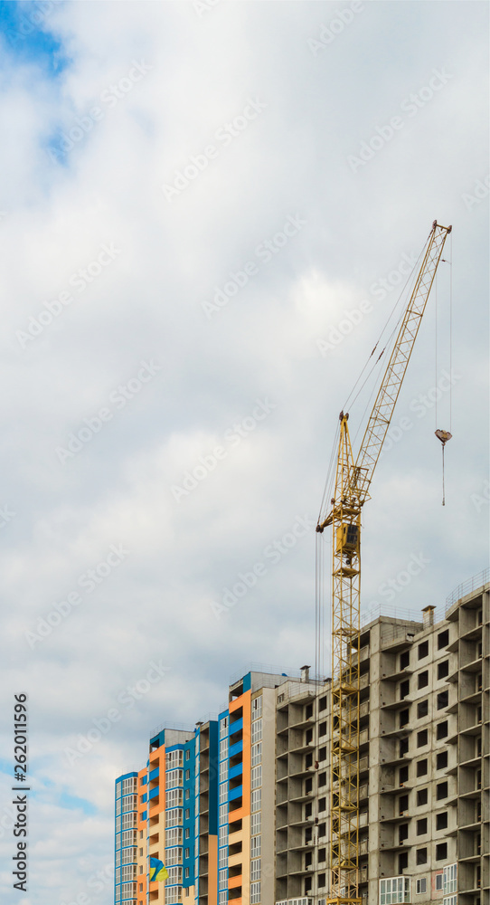 House under construction against the blue sky. House under construction against the blue sky.