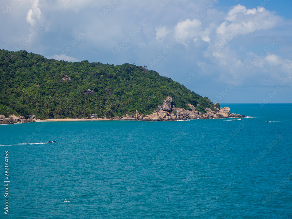 Motor boat on the surface of the sea near the island. Koh Phangan. Thailand Motor boat on the surface of the sea near the island. Koh Phangan. Thailand