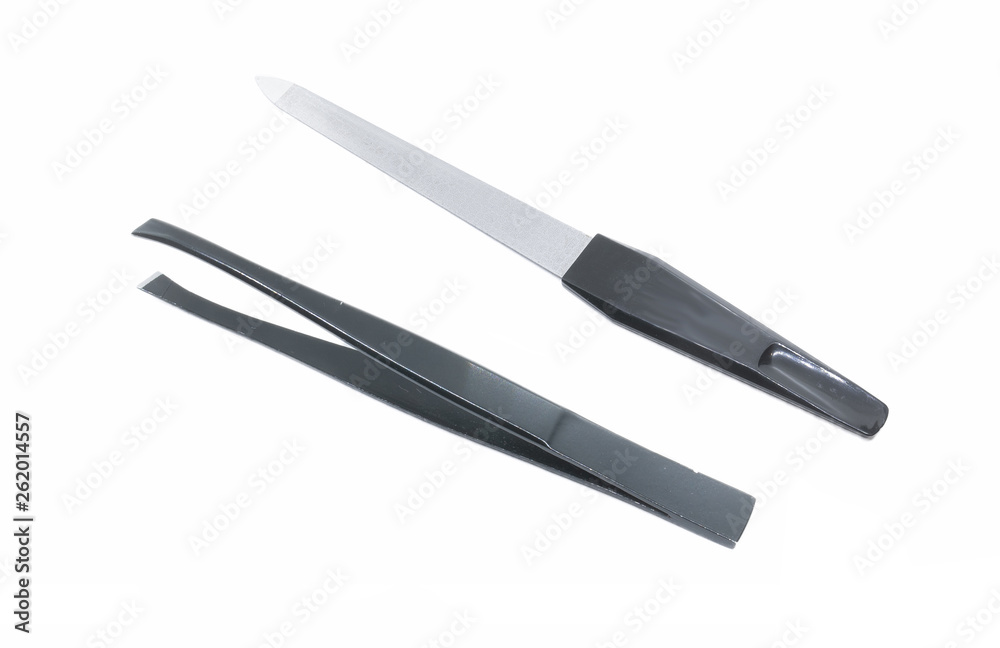 Black metal nail file. Black metal eyebrow tweezers. Female accessories for manicure and personal care isolated on white. Black metal nail file. Black metal eyebrow tweezers. Female accessories for manicure and personal care isolated on white.