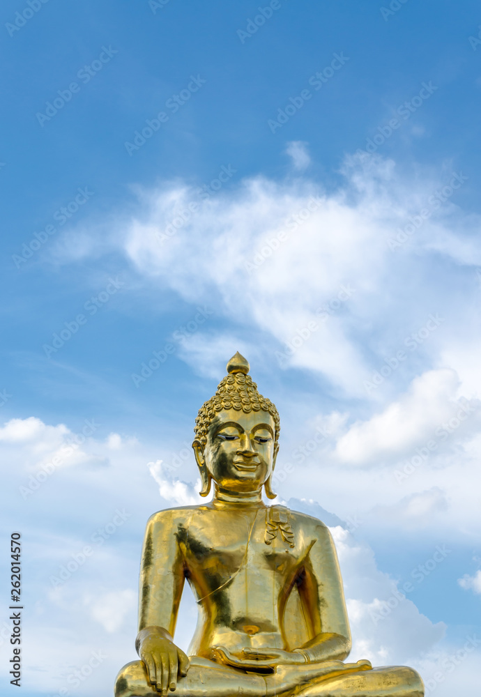 Gold color Statue in thai temple over blue sky Gold color Statue in thai temple over blue sky