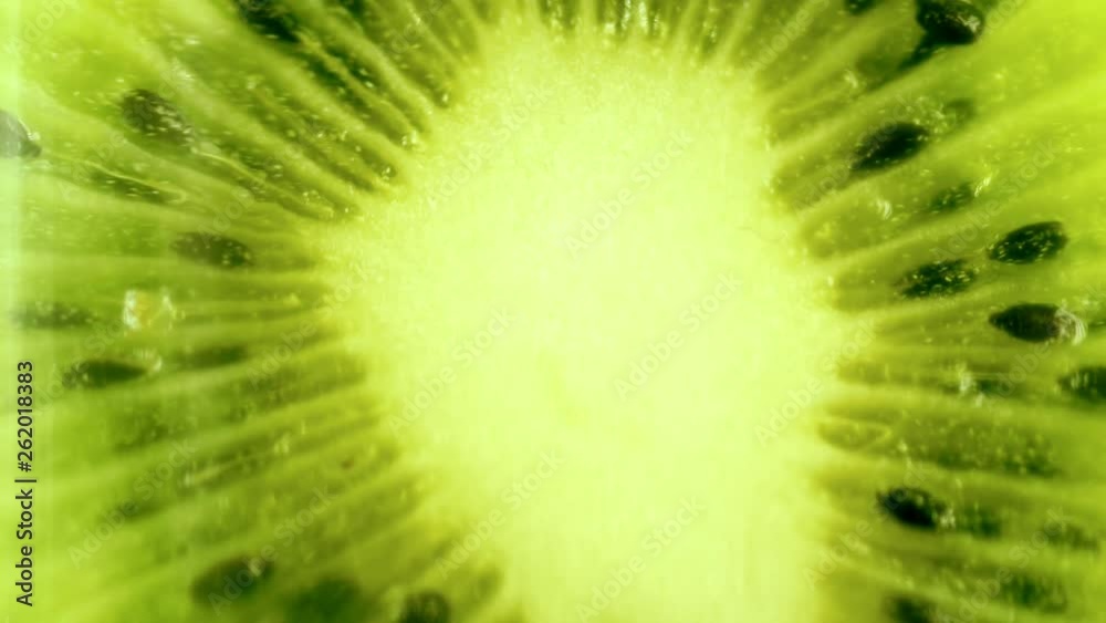 Kiwi Fruit Slices Rotating. Beautiful view Kiwi Fruit Slices Rotating. Beautiful view