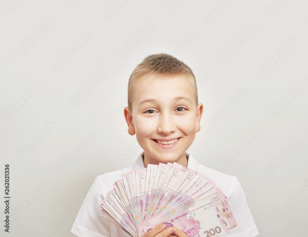 boy with money hryvnia on white background boy with money hryvnia on white background
