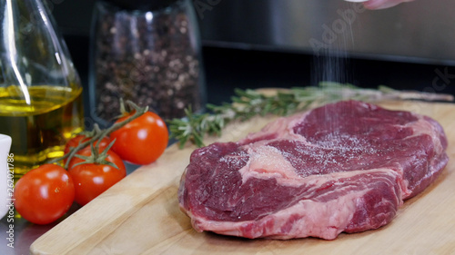 Working in the kitchen. Chef preparing the meat