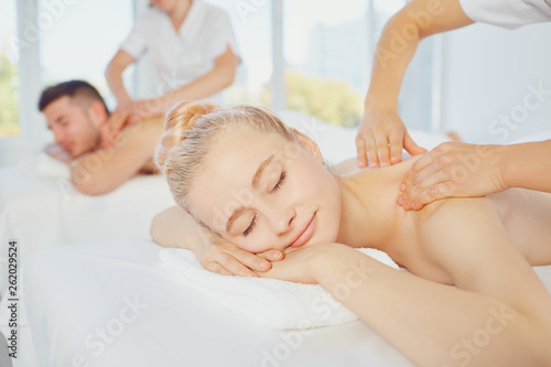 Couple enjoying massage in spa club 